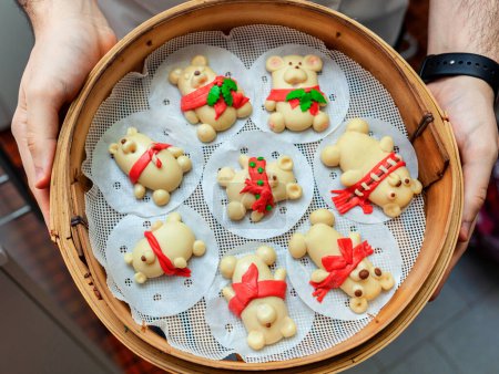 Photo for Christmas bread bears in a bamboo steamer. - Royalty Free Image