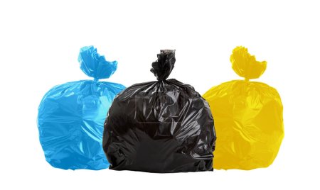 Foto de Three bags of rubbish, not recyclable, plastic and paper. - Imagen libre de derechos