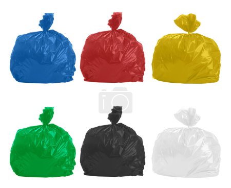 Foto de Garbage bags of different colors for separate collection. - Imagen libre de derechos