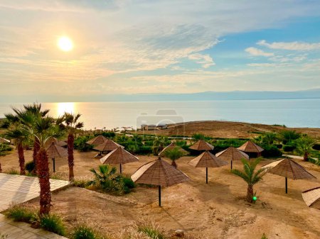 Photo for Dead Sea Beach Vacation Resort with Umbrellas in Jordan. - Royalty Free Image