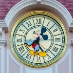 Paris, France - June 02, 2023: Mickey mouse clock tops the hotel at the Disneyland park entrance.