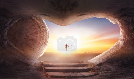 Photo for Easter concept: Empty tomb stone with cross on  sunrise background - Royalty Free Image