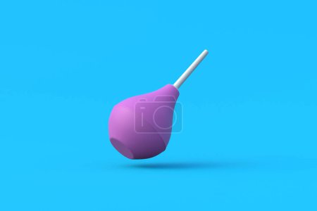 Falling enema on blue background. Rubber douching bag. Pear shaped syringe bulb. Medical clyster. Nasal aspirator. Laboratory tool. Constipation treatment. 3d render