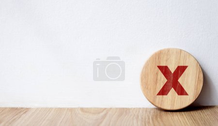 Circle wooden block with red wrong mark. Illustrate the wrong login decision concept. Vote and think wrong. Choose a business for difficult situations, true and false symbols. Choose the wrong sign
