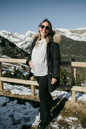 Photo for Pregnant woman on the mountain in sunny day. - Royalty Free Image