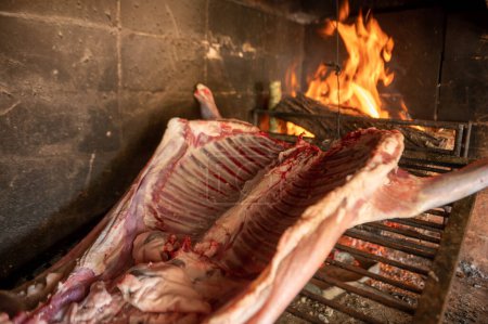 Photo for Grilled lamb made with firewood in the countryside of Uruguay. - Royalty Free Image