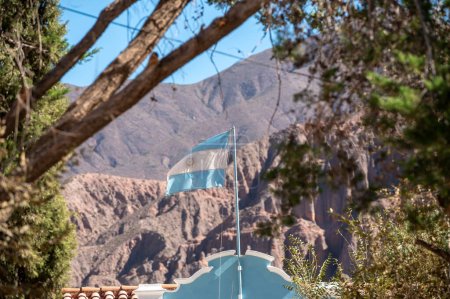 Photo for Flag of Argentina flying in the city of Tilcara in the province of Jujuy in Argentina. - Royalty Free Image