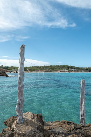 Panorama on the tourist beach of Cala Nova on the island of Ibiza in summer 2024.
