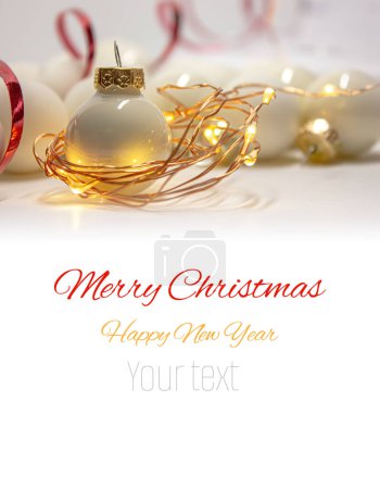 Photo for White Christmas Babules with bokeh background of christmas lights with Copy space for text. - Royalty Free Image