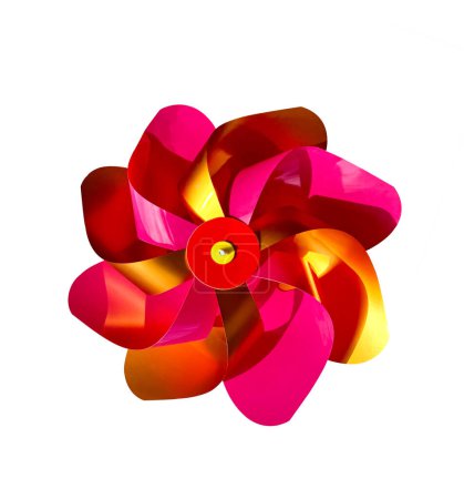 Pink and Yellow Colored pinwheel isolated on white background. Children's colorful toy wind turbine isolated on white background.