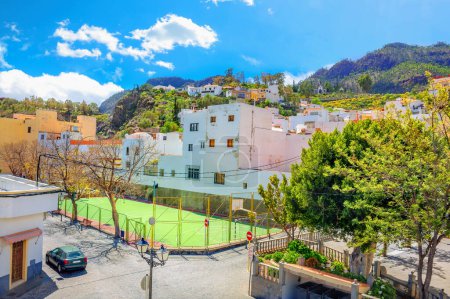 Photo for Scenic view of street with typical white houses in San Bartolome de Tirajana mountain village. Gran Canaria. Canary islands, Spain - Royalty Free Image