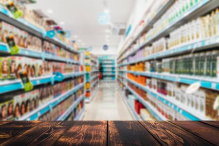 Photo for Grocery table background. Blurred supermarket shelves with goods and products. Product demonstration concept. . High quality photo - Royalty Free Image