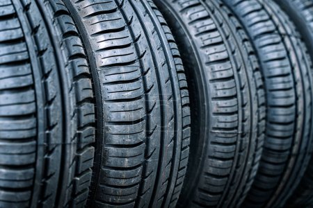 Photo for Car tires and wheels in a transport storage warehouse or car service. New tires background. High quality photo - Royalty Free Image