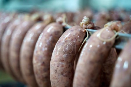 Production of meat sausages and sausages from pork and beef. Meat factory. High quality photo