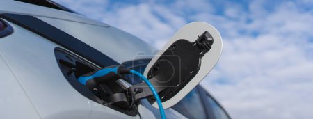 Photo for Charging electric car, sustainable transportation concept, low angle view. - Royalty Free Image