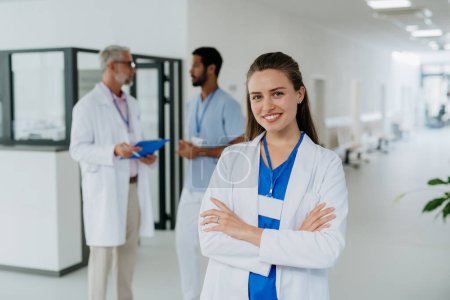 Photo for Portrait of young woman doctor at a hospital corridor. - Royalty Free Image