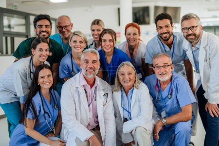 Portrait of happy doctors, nurses and other medical staff in a hospital.