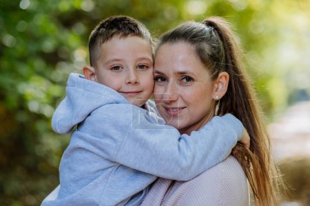 Photo for Portrait of mother with her son in a forest. - Royalty Free Image