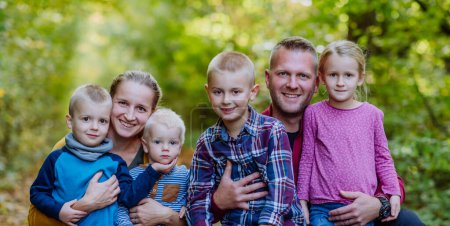 Photo for Portrait of happy family with kids in forest. - Royalty Free Image