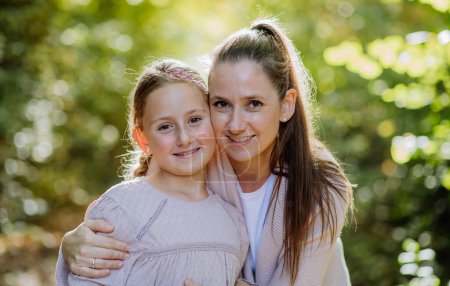 Photo for Portrait of mother with her daughter in a forest. - Royalty Free Image