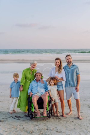 Photo for Portrait of three geneartions family with little kids enjoying time at sea in an exotic country. - Royalty Free Image
