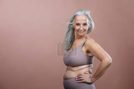 Photo for Portrait of senior woman in a lingerie, studio shoot. - Royalty Free Image