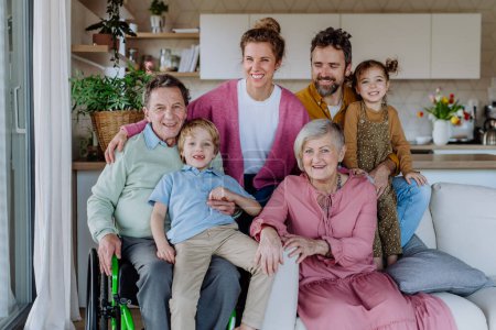 Téléchargez les photos : Portrait of happy multigenerational family in their three generation house. - en image libre de droit