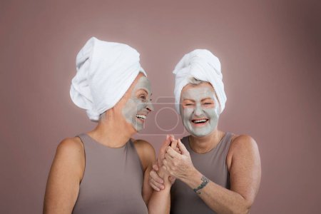 Photo for Portrait of happy senior friends with a face-mask, selfcare and skin routine concept. - Royalty Free Image