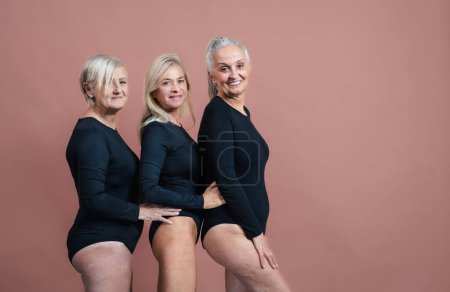 Foto de Happy three senior friends in a sportive body underwear, body positivity concept. - Imagen libre de derechos