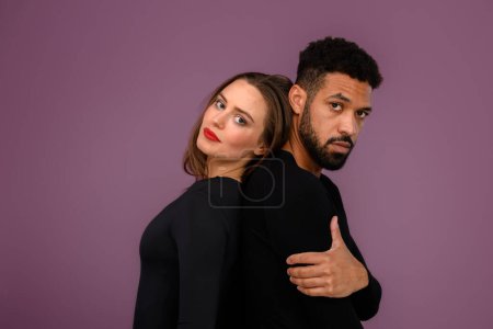 Foto de Portrait of a young multiracial couple, studio shoot. - Imagen libre de derechos