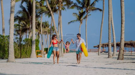 Photo for Happy family with little child enjoying time at vaccation in exotic country. - Royalty Free Image