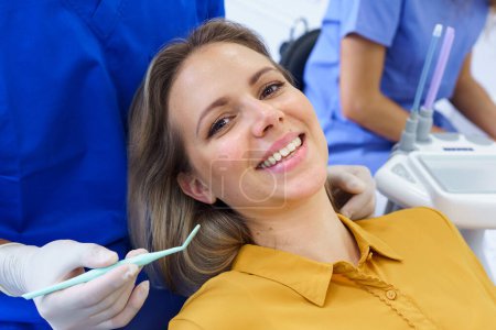 Photo for Portrait of young woman in a dentist chair. - Royalty Free Image