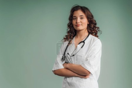 Photo for Portrait of a young curly nurse, studio shoot. - Royalty Free Image