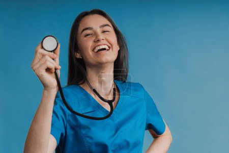 Photo for Portrait of young nurse with a stethoscope, studio shoot. - Royalty Free Image