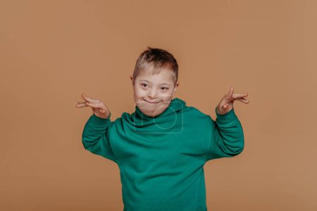 Photo for Portrait of a little boy with down syndrome, studio shoot. - Royalty Free Image
