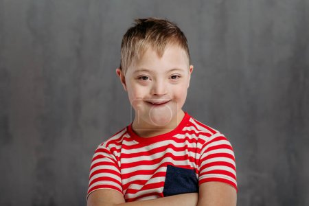 Photo for Portrait of a little boy with down syndrome, studio shoot. - Royalty Free Image