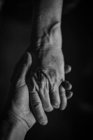 Photo for Close up of a wrinkled hands, black and white. - Royalty Free Image