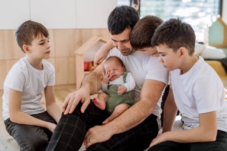 Photo for Portrait of a father and his four sons, holding his newborn baby. - Royalty Free Image