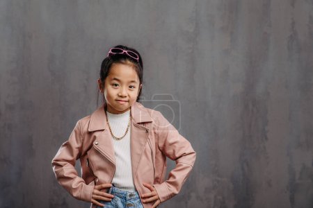 Photo for Portrait of little japanesse girl with a leather jacket. - Royalty Free Image
