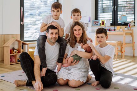 Photo for Portrait of big family with four sons enjoying their newborn baby. - Royalty Free Image