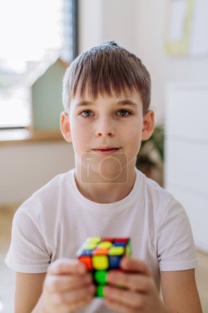 Photo for Little boy playing with cube at home. - Royalty Free Image