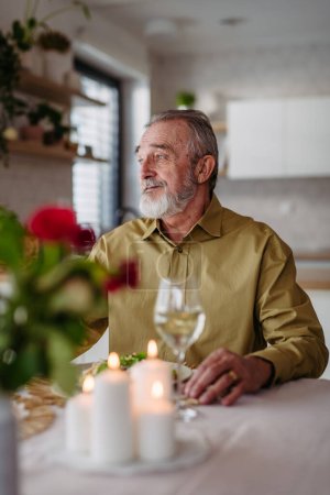 Photo for Senior man waiting for her wife for celebrating her birthday. - Royalty Free Image