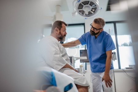 Photo for Supportive doctor soothing worried overweight patient, discussing test result in emergency room. Illnesses and diseases in middle-aged mens health. Compassionate physician supporting stressed patient - Royalty Free Image