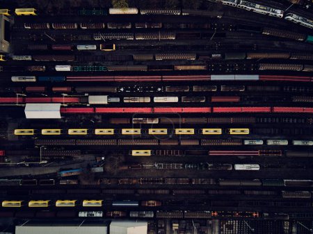 Photo for Aerial photo of railway lines, railway junction with trains. Freight wagons with goods on railroad station. Cargo transportation. Import and export logistics in railways. Industrial landscape. - Royalty Free Image