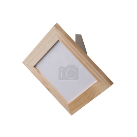 Photo for Small wooden blank picture photo frame with stand. Realistic horizontal picture frame. Empty light brown picture frame, mockup template isolated on the white background. - Royalty Free Image