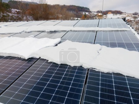 Photo for Roof solar panels with snow on top of them. Solar energy in the winter. - Royalty Free Image