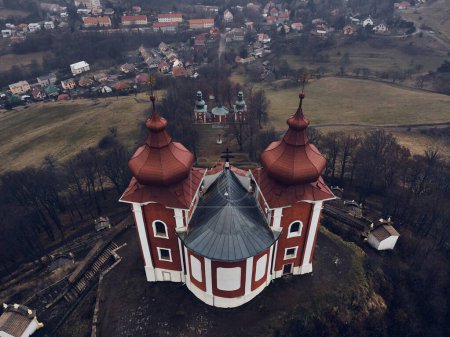Photo for Aerial view of historical church atop on the hill. Late baroque calvary in Banska Stiavnica in Slovakia. - Royalty Free Image