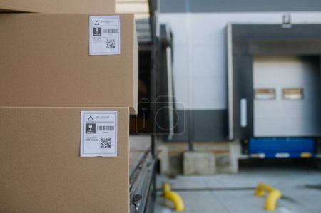 Photo for Close up of cardboard boxes, delivered goods in front of warehouse. Concept of load management. - Royalty Free Image