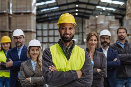 Photo for Full team of warehouse employees standing in warehouse. Team of workers, managers and female director in modern industrial factory, heavy industry, manufactrury. Group portrait. - Royalty Free Image