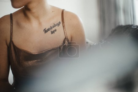 Photo for Close up of the tattoo of cancer patient, cancer awareness concept. Strong female oncology patient, determined, confident, never give up. - Royalty Free Image